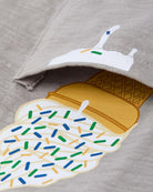 Close-up of a playful ice cream graphic on a gray pocket tee, perfect for stylish kids' summer adventures.