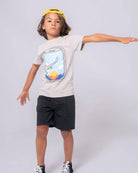 Cool kid in a soft Window Seat Graphic Tee, ready for sky-high adventures! Stylish summer boys' clothes for fun outings.