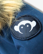 Close-up of Appaman City Transit Coat’s playful logo and chic faux fur detail, perfect for stylish winter adventures!