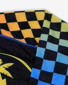 Vibrant checkerboard patterns of the Happy Surfing Rash Guard, blending fun and sun protection for active kids.