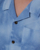 Close-up of the Appaman Blue Tie Dye Resort Shirt, showcasing its playful texture and stylish front pocket.