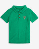Cheerful Kelly Green Fairbanks Polo with palm tree emblem—stylish kids clothes for fun outings and back to school!