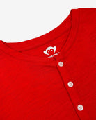 Close-up of the stylish Red Clay Henley, showcasing soft fabric and hip button details—ideal for trendy kids' wardrobes.