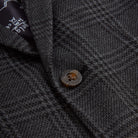Close-up of a stylish button on the Professor Plaid Club Jacket, featuring chic detailing for trendy kids' fashion.