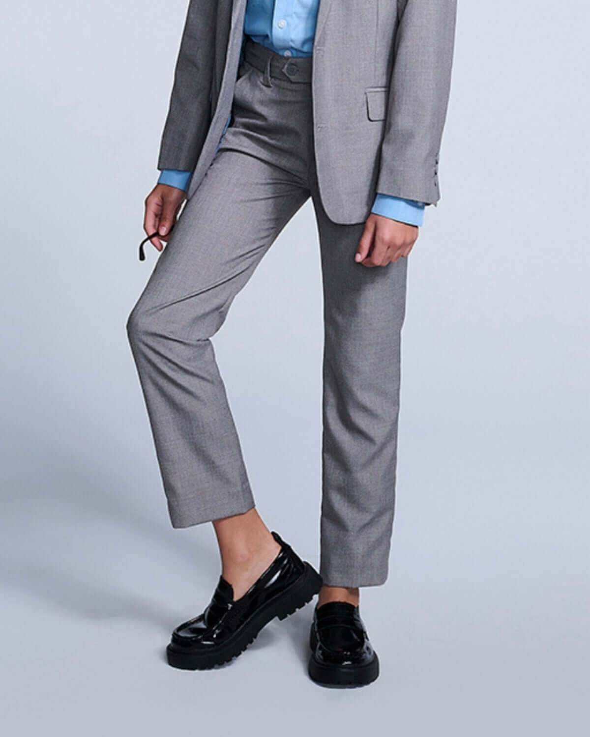 Mist Suit Pants in slim-cut style, stylishly paired with a light blue shirt and black shoes for formal events.