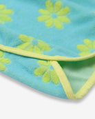 Close-up of the blue Mia dress showing cheerful daisies and bright trim—fun kids clothes for stylish adventures!