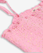 Chic close-up of the Pink Gold Madison Dress showcasing shimmery fabric and playful straps—perfect for stylish kids!