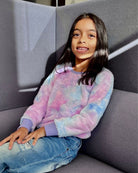 Stylish girl in cozy Berry Willow Top, showcasing a playful tie-dye design perfect for kids' back-to-school fashion!