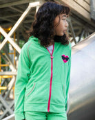 Stylish kid in mint Julia hoodie with heart patch, perfect kids clothes for fun adventures and back to school.