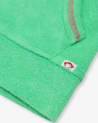 Close-up of the mint zip-up hoodie showcasing the stylish sleeve and fun Appaman tag, perfect for kids' back-to-school outfits.