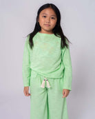 Trendy mint green beach sweater for girls, perfect for sunny days and stylish layering with shorts or swimsuits.