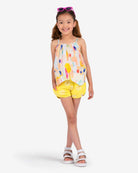 Bright and cheerful girl in Appaman's Watercolor Harper Top, perfect summer vibes in high-quality kids clothes.