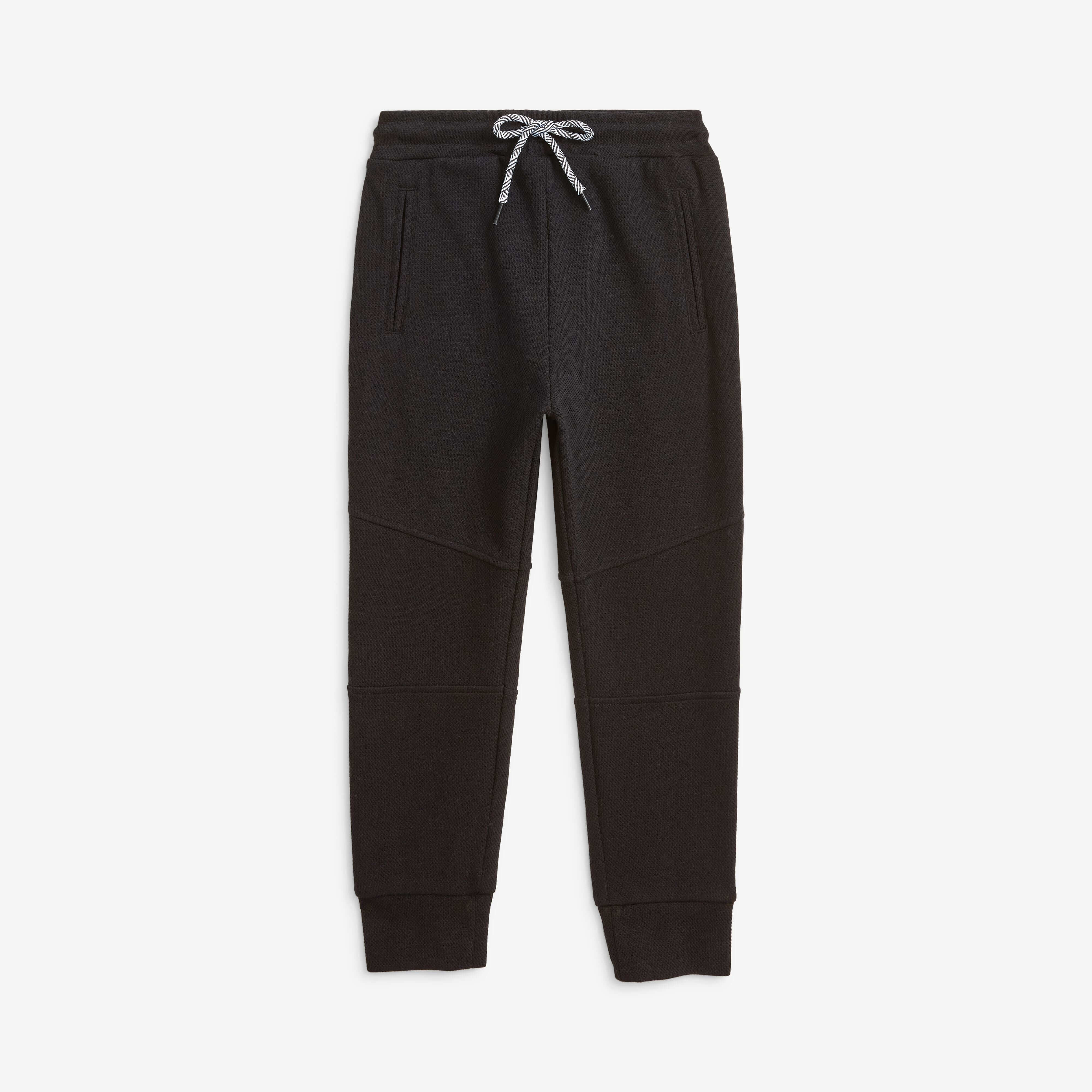 Kids' trendy black sweatpants—soft, durable, with pockets for treasures; perfect for play, lounging, and stylish adventures!