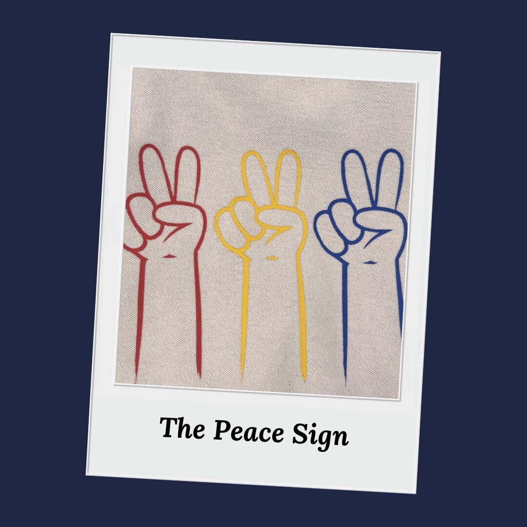 Three hands making peace signs in red, yellow, and blue on a textured background with 'The Peace Sign' text.