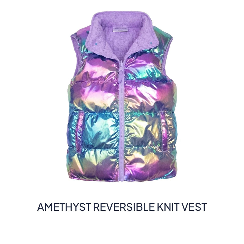 An iridescent reversible knit puffer vest with a lavender purple collar and zipper, shown against a plain white background with the text 'AMETHYST REVERSIBLE KNIT VEST' underneath.