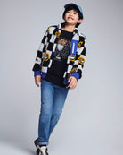 Person wearing a checkered shirt, graphic t-shirt, and jeans on a plain background