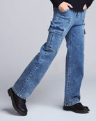 Blue jeans worn by a person on a light gray background