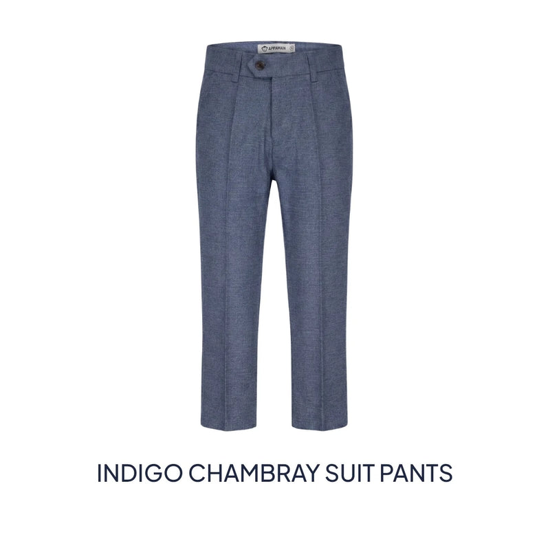 A pair of indigo chambray suit pants shown flat against a white background, with the text 'INDIGO CHAMBRAY SUIT PANTS' underneath.