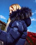 Appaman girls' navy glossy puffer coat sparkle faux fur hood, lifestyle photo.