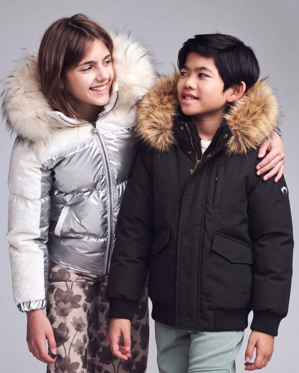 2 children wearing winter jackets