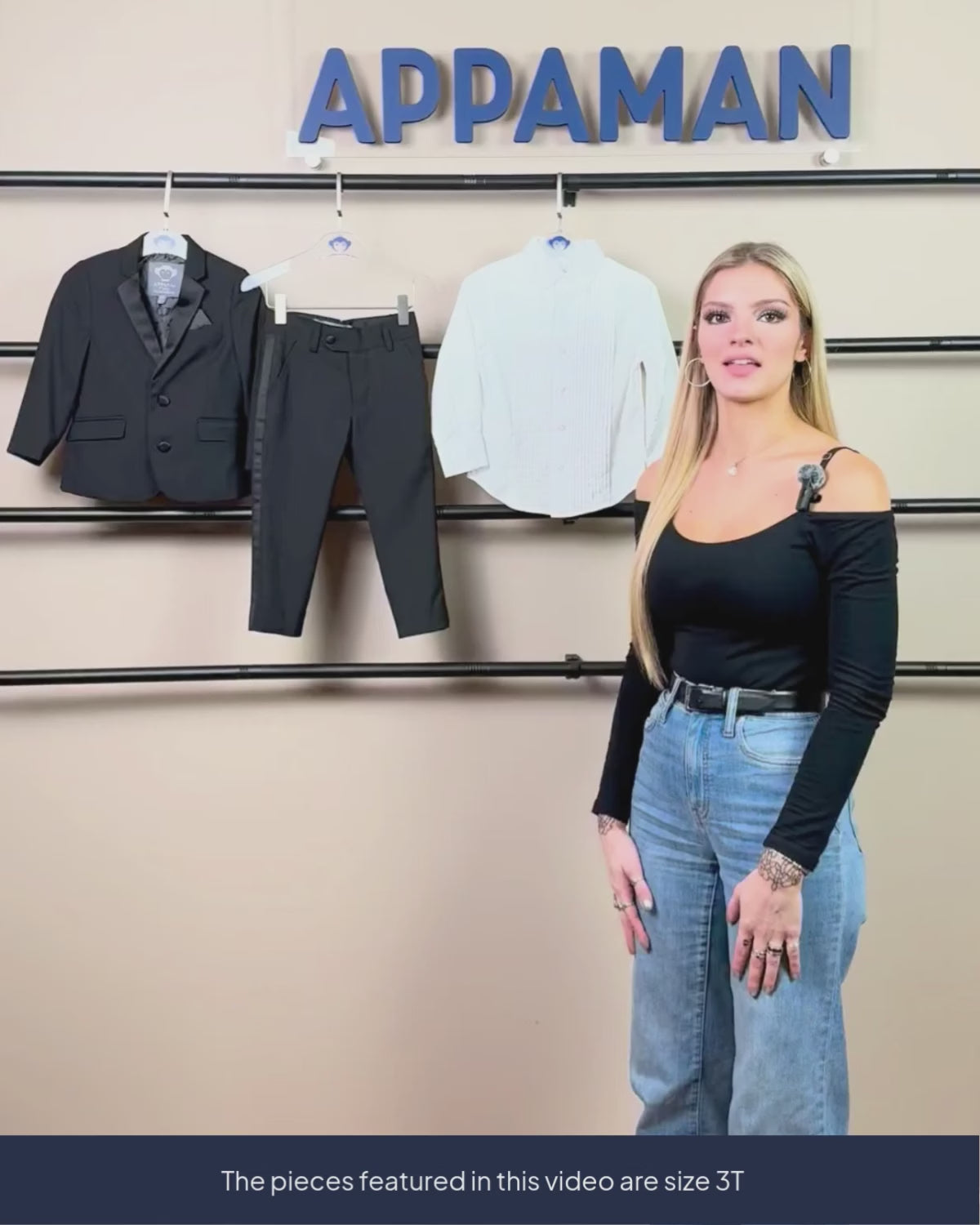 woman showing tuxedo jacket, pants and shirt