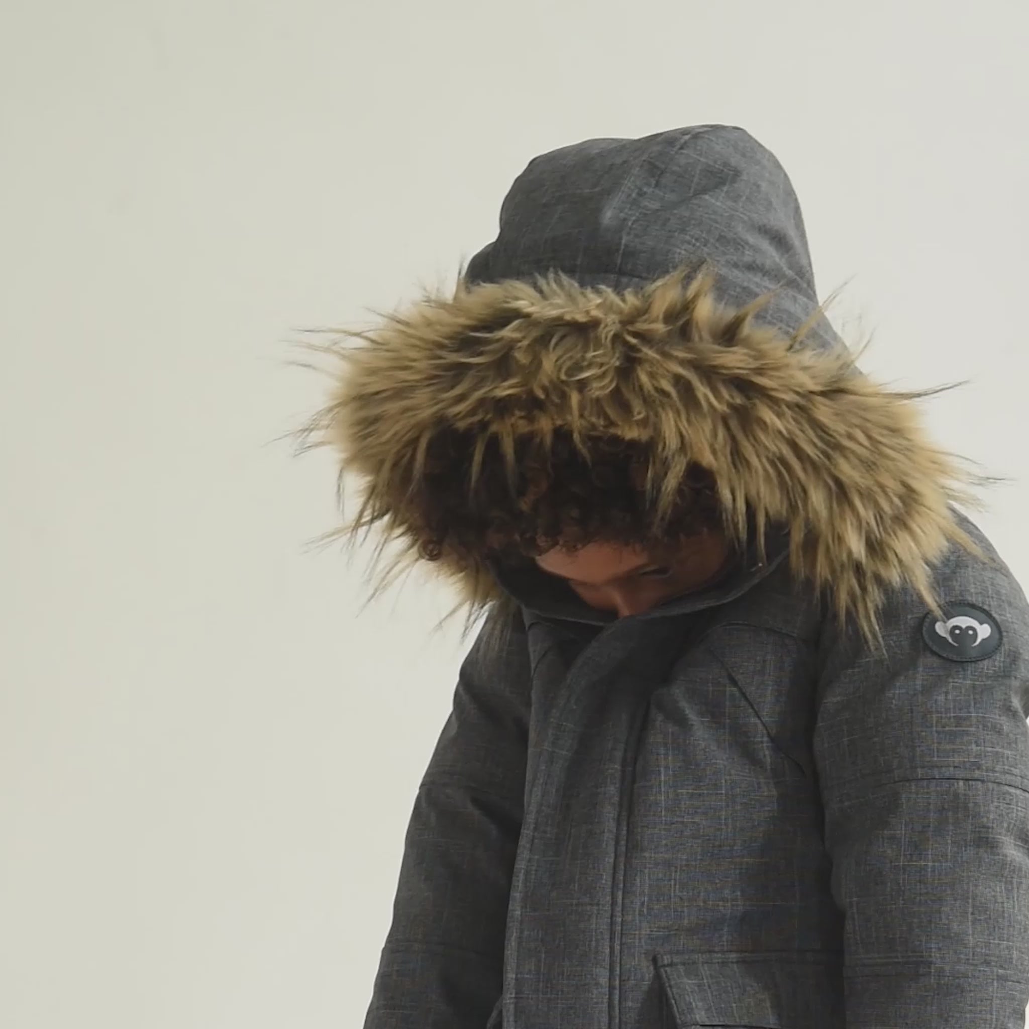 Cozy up in style with the Denali Down Coat! Perfect for kids, with a chic fur-trimmed hood and warm sherpa lining.